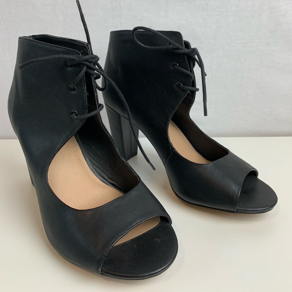 NEW. Never used, faux leather, black, peep toe pump. Size 9W.